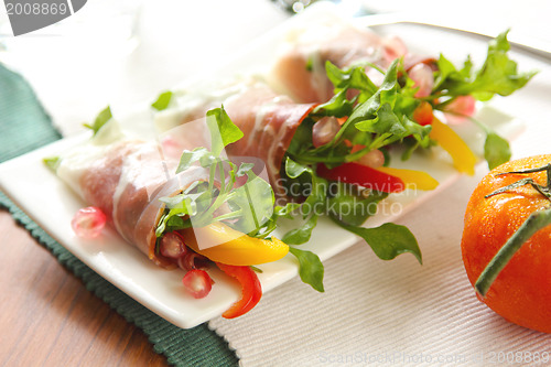 Image of Smoked ham with vegetables and pomegranate