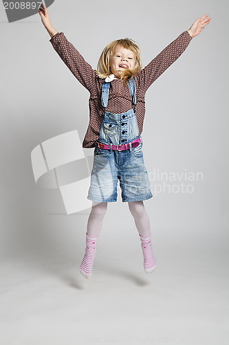 Image of Happy young girl jumping