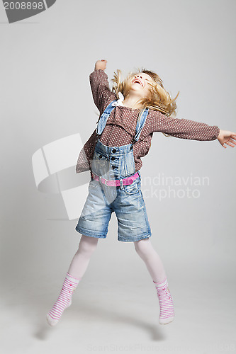 Image of Happy young girl jumping