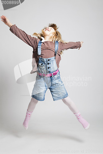 Image of Happy young girl jumping