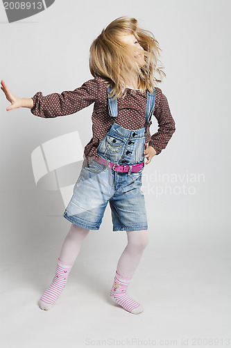 Image of Happy young girl dancing