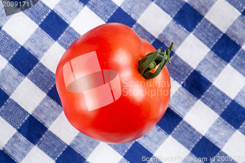 Image of red tomato on table