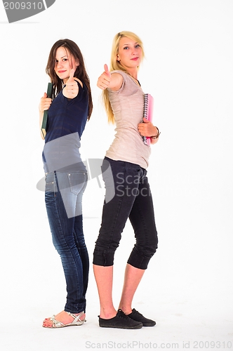 Image of Two beautiful student girls showing thumbs up