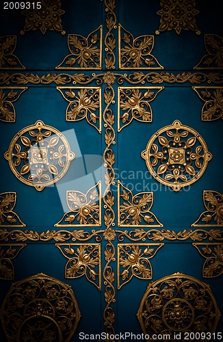 Image of Golden metal lattice on steel background