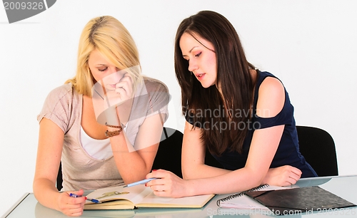 Image of Two beautiful student girls getting ready for school