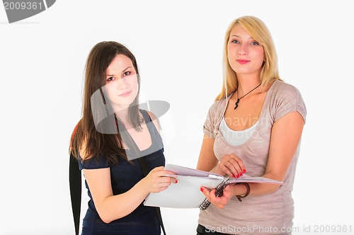 Image of Two beautiful student girls getting ready for school