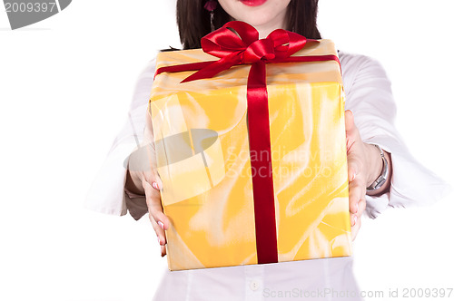 Image of Young woman with christmas present