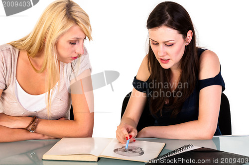 Image of Two beautiful student girls getting ready for school