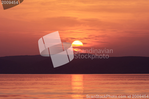 Image of Sunset at the beach with red sky