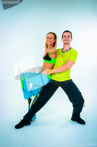 Image of Acrobatic dancing with two young trainers