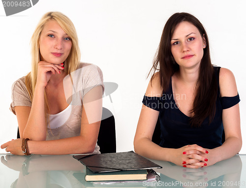 Image of Two beautiful student girls getting ready for school