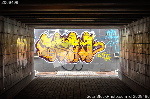 Image of Dark tunnel with grafiti