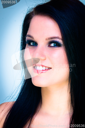 Image of Closeup of a cheerful young woman smiling
