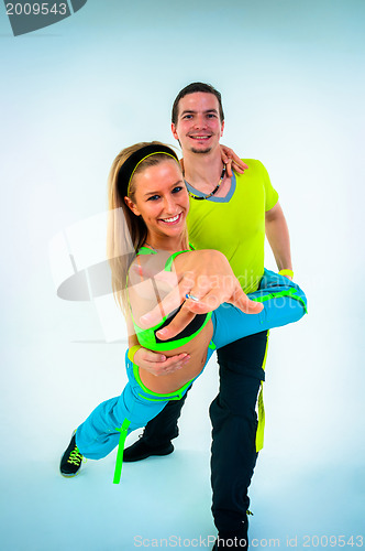 Image of Acrobatic dancing with two young trainers