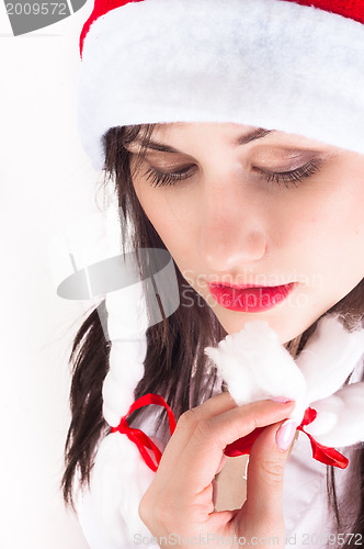 Image of Young woman with christmas present