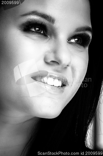 Image of Closeup of a cheerful young woman smiling
