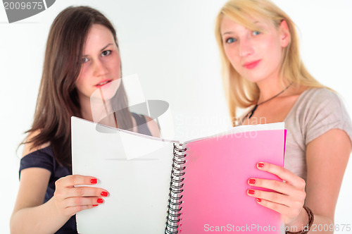 Image of Two beautiful student girls getting ready for school