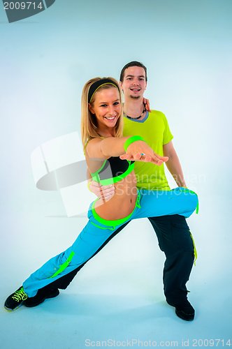 Image of Acrobatic dancing with two young trainers