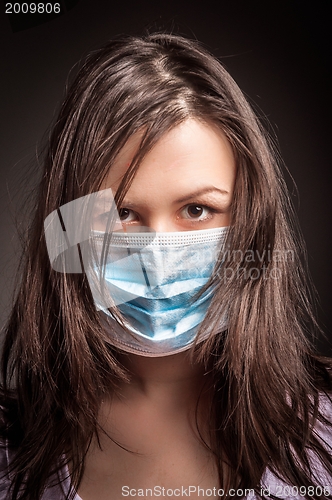Image of Young woman in a protective mask