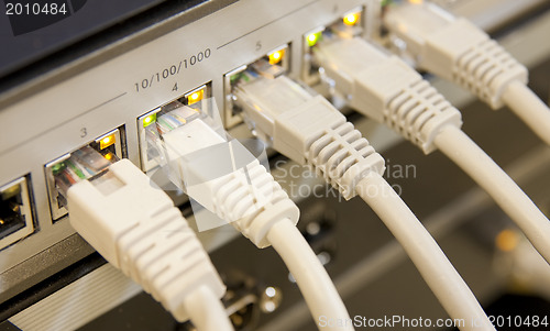 Image of network cables connected to switch