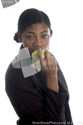 Image of pretty black woman eating apple