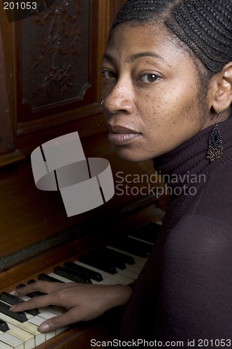 Image of pretty black woman at piano