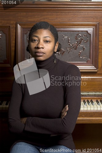 Image of pretty black woman at piano