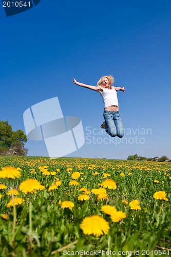 Image of happy young woman on meadow