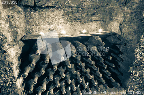 Image of wine bottles with candles
