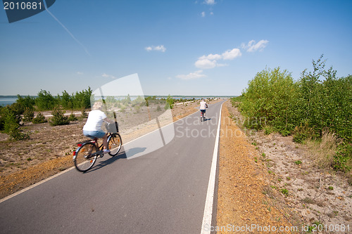 Image of family cycling