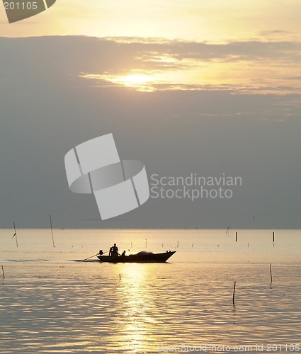 Image of Fishing boat at sunset