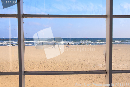 Image of beach view through window