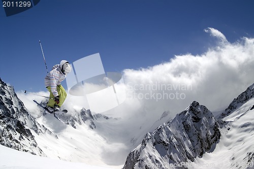 Image of Freestyle ski jumper with crossed skis