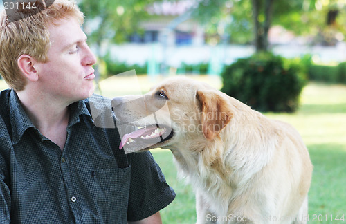 Image of Man in the park with his dog