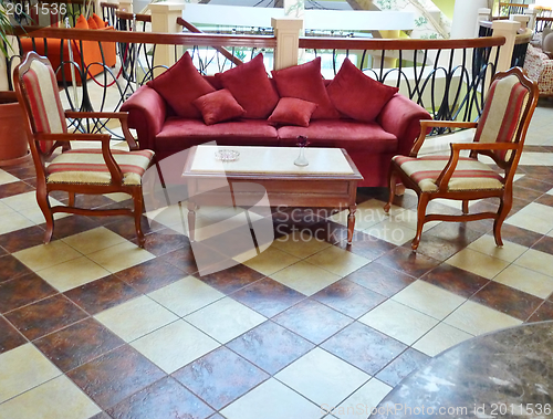 Image of Sofa with chairs in lobby