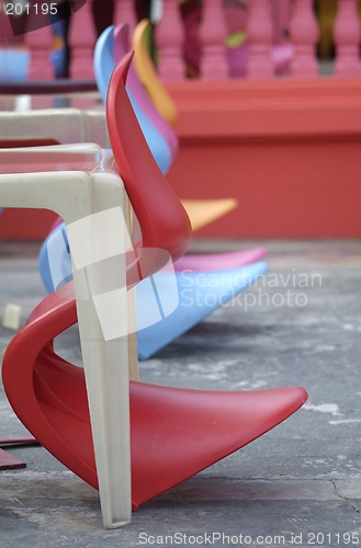 Image of Row of colourful plastic chairs