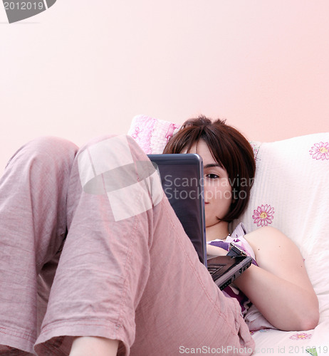 Image of Young woman with laptop 