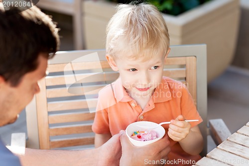 Image of family in outdoor cafe