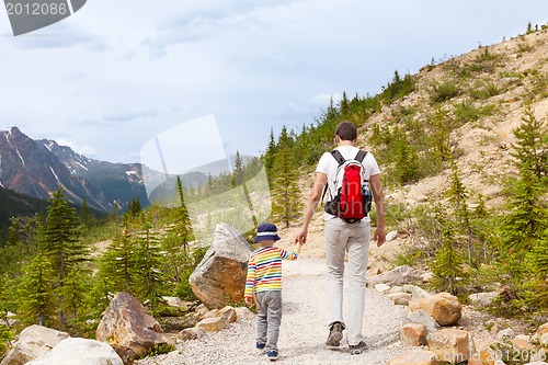 Image of father and his son walking