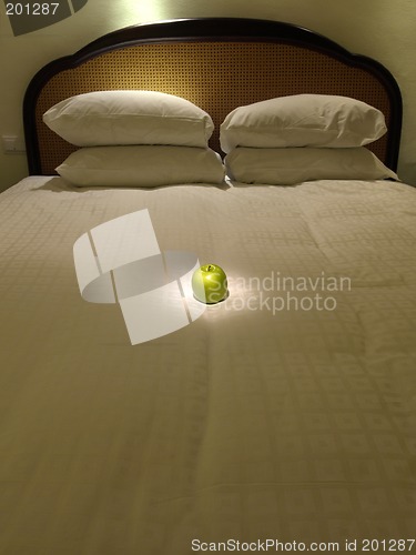 Image of Apple in bed