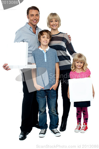 Image of Family of four. Father and daughter holding pizza boxes.