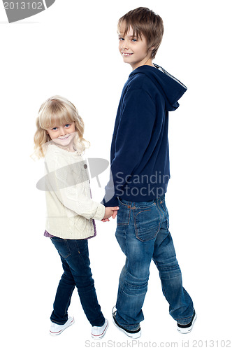 Image of Delightful kids turning back and facing camera