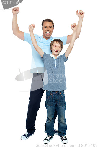 Image of Father and son celebrating their success