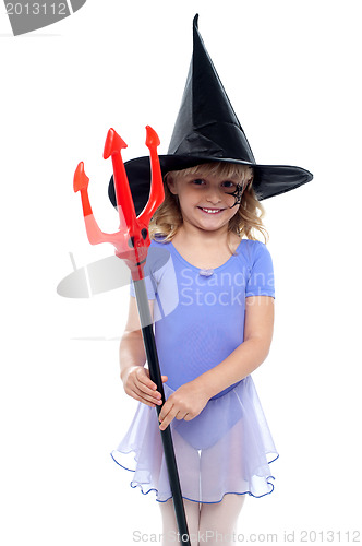 Image of Cute girl holding pitchfork and wearing witches hat