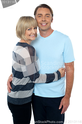 Image of Charming middle aged lady embracing her husband