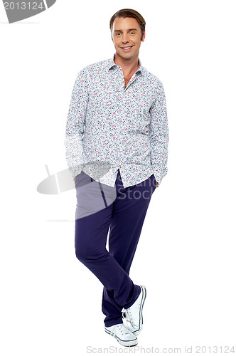 Image of Calm and relaxed middle age man posing casually