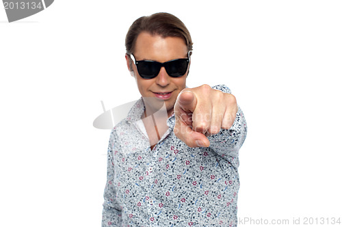 Image of Smart looking man pointing at the camera