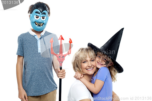 Image of Young boy and cute girl participating in halloween celebration