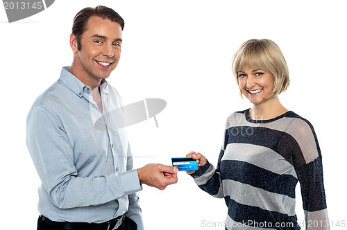 Image of Middle aged couple showing cash card to you
