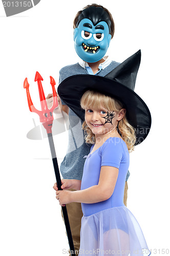 Image of Young brother and sister in halloween costume